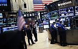 This June 17, 2015 file photo shows traders on the main trading floor the New York Stock Exchange.    (AFP/KENA BENTACUR)