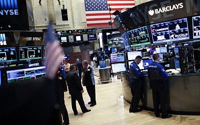 This June 17, 2015 file photo shows traders on the main trading floor the New York Stock Exchange.    (AFP/KENA BENTACUR)
