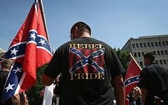 Ku Klux Klan members take part in a Klan demonstration at the state house building on July 18, 2015 in Columbia, South Carolina. (John Moore/Getty Images/AFP)