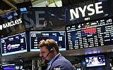 A trader works on the floor of the New York Stock Exchange (NYSE), New York City, July 21, 2015. 
(Spencer Platt/Getty Images/AFP)