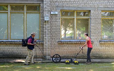 Archaeologists conducting a Ground Penetrating Radar survey at the site of the Great Synagogue of Vilna in Lithuania, June 2015. (Jon Seligman, Courtesy of the Israel Antiquities Authority)