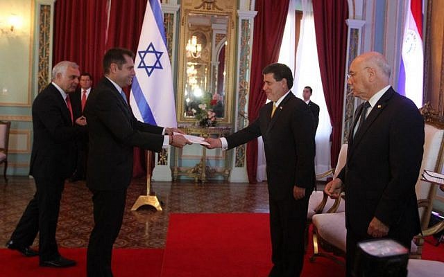 Israeli ambassador to Paraguay Peleg Levy submits the charter to reopen the Israeli embassy to President Horacio Cartes on July 27, 2015 (Courtesy Foreign Ministry)