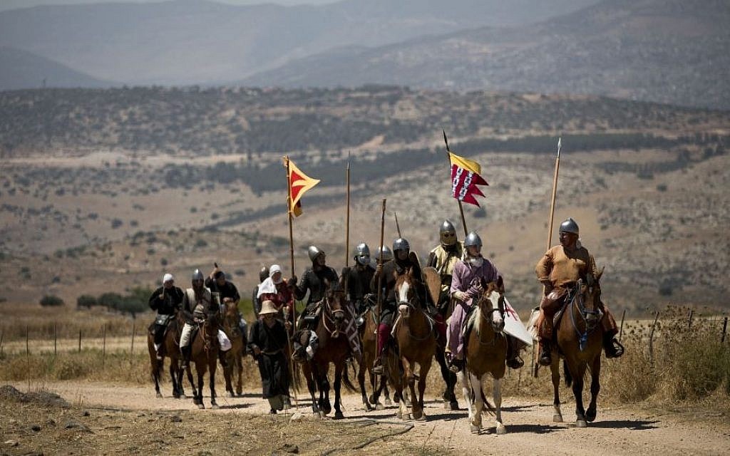 Israeli and Russian members of knight clubs, ride their horses on their way to the reenactment of the Battle of Hattin in the Horns of Hattin, northern Israel, July 4, 2015 (AP/Oded Balilty)