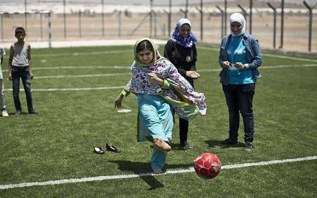 Nobel Peace Prize recipient Malala Yousafzai, 18, kicks the ball while playing soccer with Syrian refugee children during her visit to Azraq refugee camp in Jordan, Monday, July 13, 2015. (AP Photo/Muhammed Muheisen) Nobel Peace Prize recipient Malala Yousafzai, 18, kicks the ball while playing soccer with Syrian refugee children during her visit to Azraq refugee camp in Jordan, Monday, July 13, 2015. (AP Photo/Muhammed Muheisen)