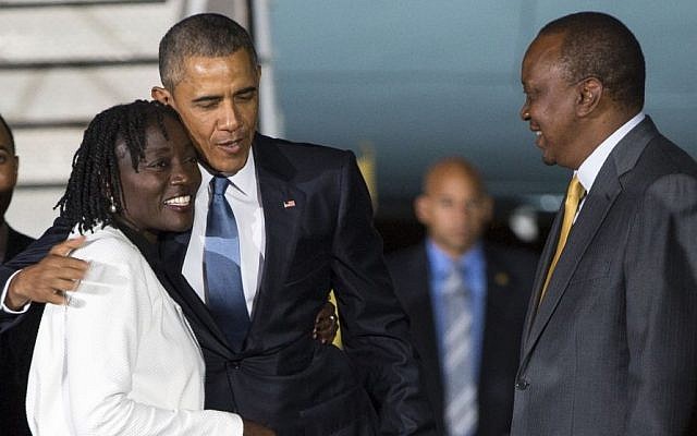 Kenyan President Uhuru Kenyatta, right, watches as President Barack Obama, center, hugs his half-sister Auma Obama, after he arrived at Kenyatta International Airport, on Friday, July 24, 2015, in Nairobi, Kenya (AP Photo/Evan Vucci) Kenyan President Uhuru Kenyatta, right, watches as President Barack Obama, center, hugs his half-sister Auma Obama, after he arrived at Kenyatta International Airport, on Friday, July 24, 2015, in Nairobi, Kenya (AP Photo/Evan Vucci)