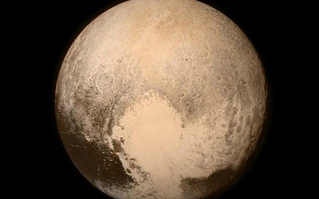 This July 13, 2015 image provided by NASA shows Pluto, seen from the New Horizons spacecraft. (NASA via AP)