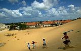 Israeli children play on a sand dune overlooking their homes in the Jewish settlement of Neve Dekalim, in the Gush Katif bloc  in the southern Gaza Strip, Monday, Aug. 8, 2005. N (AP Photo/David Guttenfelder)