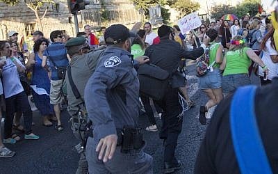 Security forces reach for an ultra-Orthodox Jew attacking people with a knife during a Gay Pride parade Thursday, July 30, 2015 in central Jerusalem. (AP Photo/Sebastian Scheiner) Security forces reach for an ultra-Orthodox Jew attacking people with a knife during a Gay Pride parade Thursday, July 30, 2015 in central Jerusalem. (AP Photo/Sebastian Scheiner)