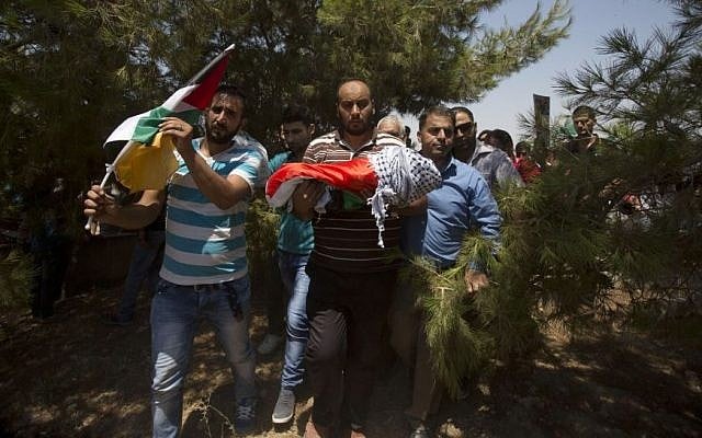 Palestinians carry the body of one-and-a-half year old Ali Dawabsha during his funeral in Duma village near the West Bank city of Nablus, Friday, July 31, 2015. The infant was burned to death in an apparent 'price tag' attack by Jewish terrorists. (AP Photo/Majdi Mohammed)