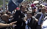 Aleksandar Vucic, Serbia's prime minister, center, is seen during a scuffle at the Potocari memorial complex near Srebrenica, 150 kilometers northeast of Sarajevo, Bosnia and Herzegovina, Saturday, July 11, 2015. (AP/Marko Drobnjakovic)