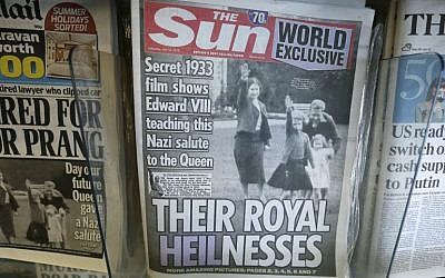A row of newspapers on display including a paper with a photo of Britain's Queen Elizabeth as a child giving a Nazi salute, in a shop, in London, Saturday July 18, 2015. (AP Photo/Tim Ireland)