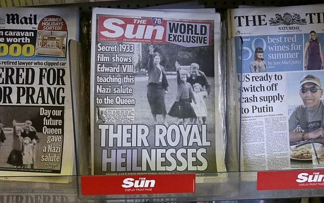 A row of newspapers on display including a paper with a photo of Britain's Queen Elizabeth as a child giving a Nazi salute, in a shop, in London, Saturday July 18, 2015. (AP Photo/Tim Ireland) A row of newspapers on display including a paper with a photo of Britain's Queen Elizabeth as a child giving a Nazi salute, in a shop, in London, Saturday July 18, 2015. (AP Photo/Tim Ireland)