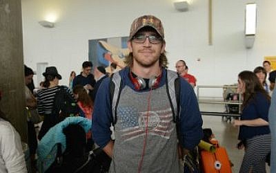 Professional lacrosse player Chase Clark at John F. Kennedy Airport in New York shortly before his flight to Israel, July 13, 2015. (Courtesy of Shahar Azran/Nefesh B’Nefesh/JTA) Professional lacrosse player Chase Clark at John F. Kennedy Airport in New York shortly before his flight to Israel, July 13, 2015. (Courtesy of Shahar Azran/Nefesh B’Nefesh/JTA)