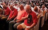 People bow their heads during an interfaith memorial service for the Tennessee shooting victims, Friday, July 17, 2015, in Chattanooga, Tennessee. (Doug Strickland/Chattanooga Times Free Press via AP)
