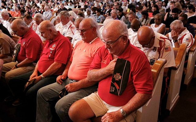 People bow their heads during an interfaith memorial service for the Tennessee shooting victims, Friday, July 17, 2015, in Chattanooga, Tennessee. (Doug Strickland/Chattanooga Times Free Press via AP) People bow their heads during an interfaith memorial service for the Tennessee shooting victims, Friday, July 17, 2015, in Chattanooga, Tennessee. (Doug Strickland/Chattanooga Times Free Press via AP)