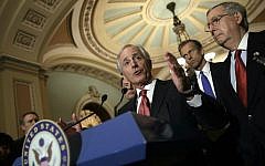 Sen. Bob Corker of Tennessee (center), the Foreign Relations Committee chairman, at a Washington news conference in March 2015. (Win McNamee/Getty Images via JTA)