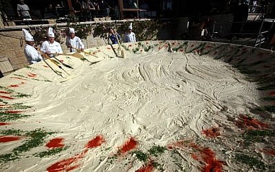 Employees of the Abu Gosh restaurant prepare a 4-ton bowl of hummus for a Guinness World Record in 2010. (Yossi Zamir/Flash90)