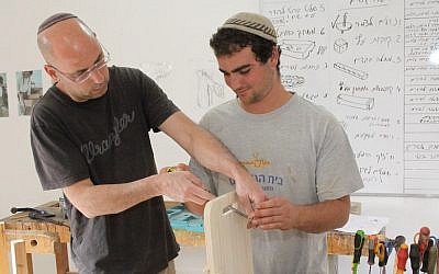 A student (R) in a mainstreaming program in Gush Etzion March 6, 2014. (Gershon ELinson/FLASH90)
