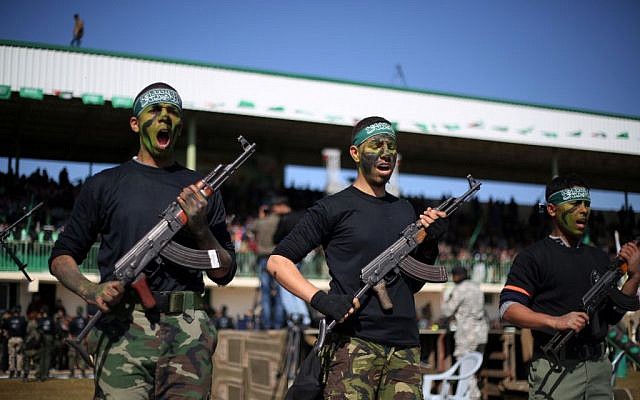 Palestinian youths take part in a graduation ceremony after being trained at Hamas-run 'pioneers of liberation' camps in Khan Yunis in the southern Gaza Strip, January 29, 2015. (Abed Rahim Khatib/Flash90)