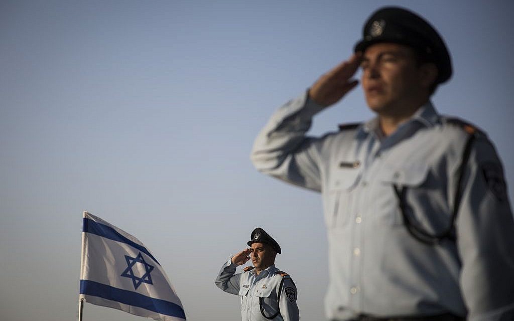 Israeli policemen salute the graves of fallen officers during a memorial ceremony in the police section of the Mount Herzl Military Cemetery in Jerusalem, on April 19, 2015 (Hadas Parush/Flash90) Israeli policemen salute the graves of fallen officers during a memorial ceremony in the police section of the Mount Herzl Military Cemetery in Jerusalem, on April 19, 2015 (Hadas Parush/Flash90)