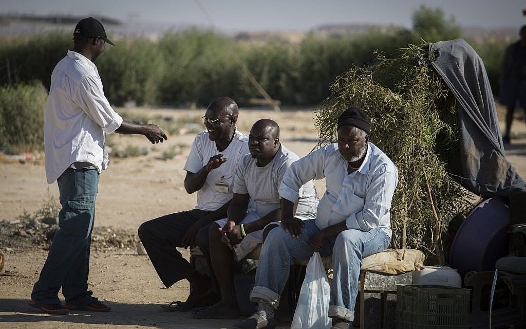 African refugees sit outside the Holot detention center in southern Israel, on June 13, 2015. (Hadas Parush/Flash90)