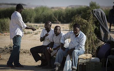 African refugees sit outside the Holot detention center in southern Israel, on June 13, 2015. (Hadas Parush/Flash90)