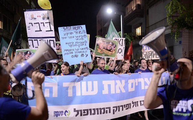 Israelis protest in Tel Aviv on July 4, 2015 against a plan to allow America's Noble Energy and Israel's Delek Group access to Israel's Tamar and Leviathan offshore natural gas reserves. (Tomer Neugberg/Flash90) Israelis protest in Tel Aviv on July 4, 2015 against a plan to allow America's Noble Energy and Israel's Delek Group access to Israel's Tamar and Leviathan offshore natural gas reserves. (Tomer Neugberg/Flash90)