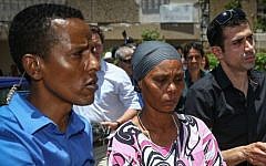 Agurnesh Mengistu, the mother of Avraham Mengistu, center, seen at a press conference at their home in Ashkelon, after a gag order was lifted over his disappearance in the Gaza Strip, on July 8, 2015. (Flash90)