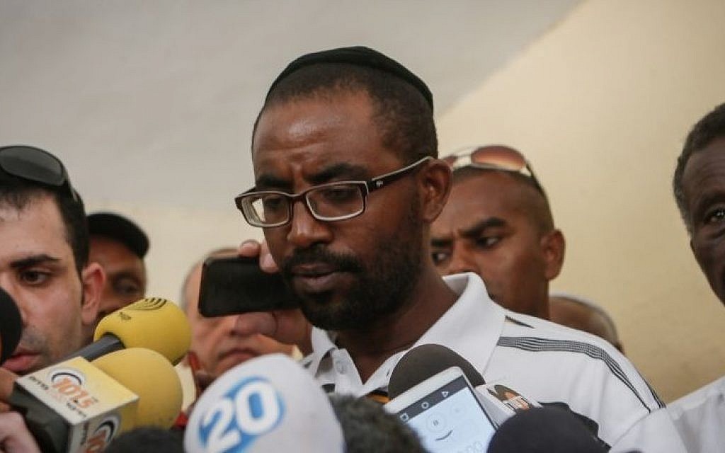 The brother of Avraham Mengistu speaks with the media at their home in Ashkelon, after a gag order was been lifted over Mengistu's disappearance in the Gaza Strip, on July 8, 2015. (Miriam Alster/Flash90)