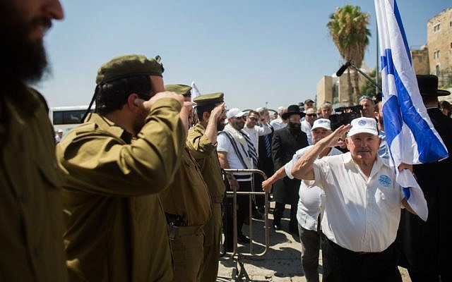 Holocaust survivors arrive to celebrate their belated bar mitzvah at the Western Wall, Judaism's holiest site, in Jerusalem's Old City on July 13, 2015. (Yonatan Sindel/Flash90)