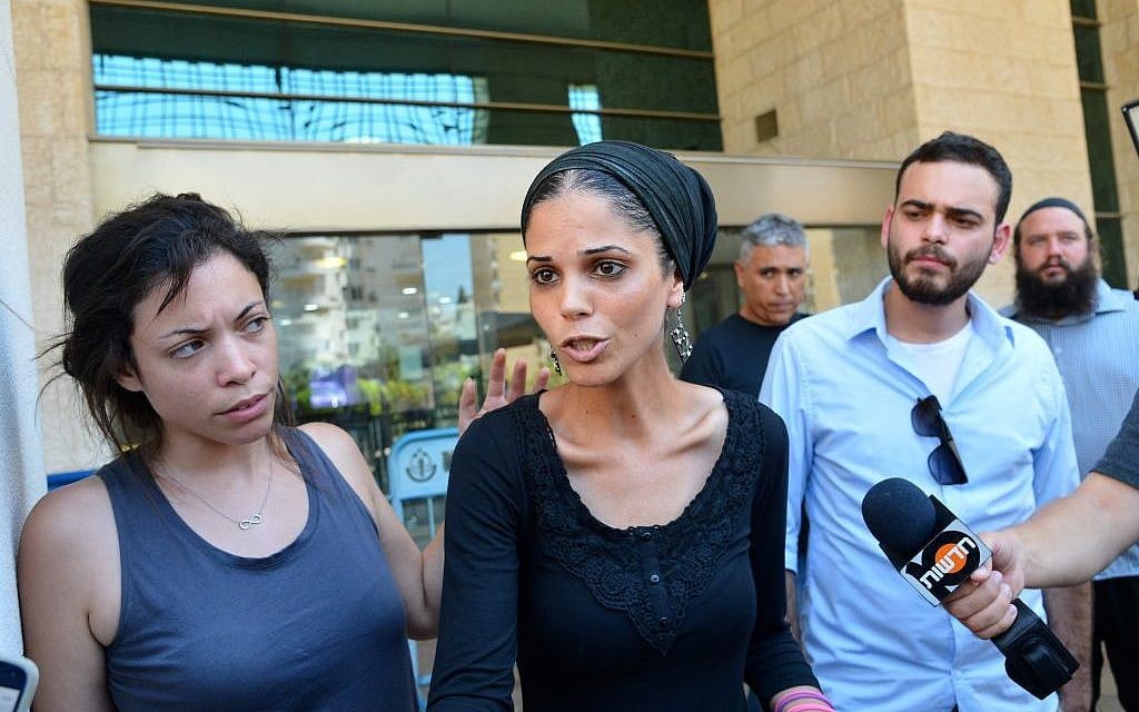 The family of David Bar-Kapara, an Israeli farmer found dead in a field in June, give a statement to the media outside the Rishon Letzion court on July 16, 2015. (Flash90)