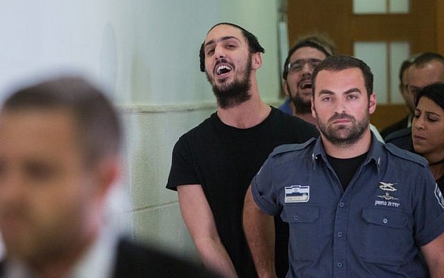 Shlomo Twitto (c) outside the District Court in Jerusalem on July 22, 2015. (Yonatan Sindel/Flash90) Shlomo Twitto (c) outside the District Court in Jerusalem on July 22, 2015. (Yonatan Sindel/Flash90)