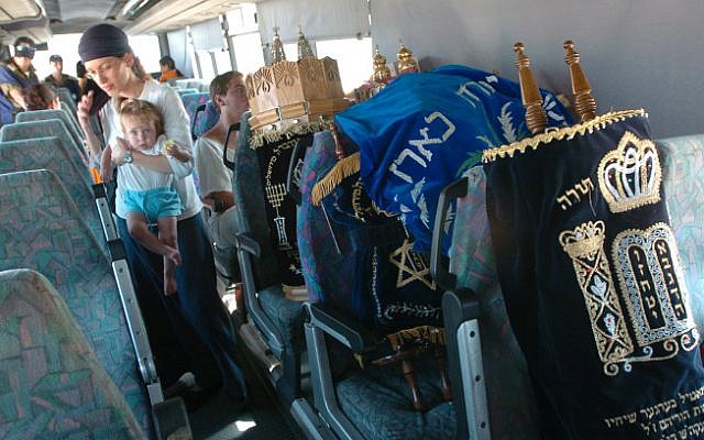 Israeli settlers and Torah scrolls being evacuated from the Gaza Strip on August 21, 2005 (Nati Shohat/ Flash 90) Israeli settlers and Torah scrolls being evacuated from the Gaza Strip on August 21, 2005 (Nati Shohat/ Flash 90)