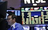 Traders work on the floor at the New York Stock Exchange in New York, Wednesday, July 8, 2015. (AP Photo/Seth Wenig)