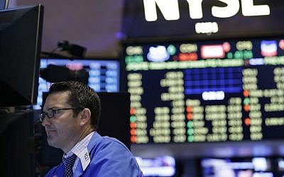 Traders work on the floor at the New York Stock Exchange in New York, Wednesday, July 8, 2015. (AP Photo/Seth Wenig)