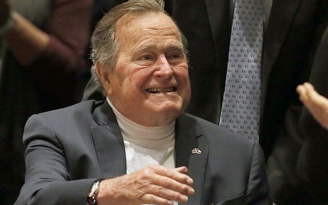 In this Nov. 11, 2014, file photo, former President George H.W. Bush acknowledges the crowd at his presidential library before his son former President George W. Bush discusses his new book '41: A Portrait of My Father' in College Station, Texas. (AP Photo/Texas Tribune, Bob Daemmrich, Pool) In this Nov. 11, 2014, file photo, former President George H.W. Bush acknowledges the crowd at his presidential library before his son former President George W. Bush discusses his new book '41: A Portrait of My Father' in College Station, Texas. (AP Photo/Texas Tribune, Bob Daemmrich, Pool)