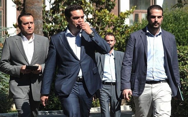 Greece's Prime Minister Alexis Tsipras, center, leaves after a meeting with Greek political party leaders as Minister of State Nikos Pappas, left, and Government spokesman Gabriel Sakellaridis, right, follow him in Athens, Monday, July 6, 2015. (AP/Angelos Christofilopoulos) Greece's Prime Minister Alexis Tsipras, center, leaves after a meeting with Greek political party leaders as Minister of State Nikos Pappas, left, and Government spokesman Gabriel Sakellaridis, right, follow him in Athens, Monday, July 6, 2015. (AP/Angelos Christofilopoulos)