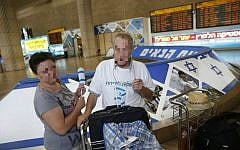 In a photo pixelated for security reasons, David and his wife arrive at Ben-Gurion Airport from Ukraine Wednesday, July 1, 2015. (Baz Ratner)