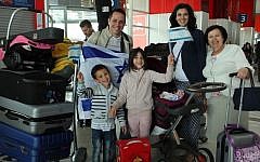 Illustrative photo of French Jewish families about to immigrate to Israel at Charles de Gaulle Airport outside Paris on July 27, 2015 (Jeremy Fournée/The Jewish Agency for Israel)
