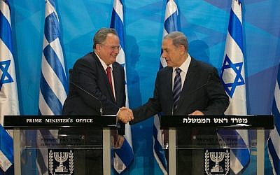 Prime Minister Benjamin Netanyahu (right) shakes hands with Greek Foreign Minister Nikos Kotzias during a joint press conference at the Prime Minister's Office in Jerusalem, July 6, 2015. (Ohad Zwigenberg/Flash90/Pool)