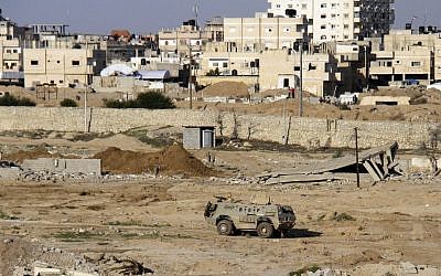 In this Nov. 6, 2014, file photo, an Egyptian armored vehicle is seen on the Egyptian side of the border across from Rafah in north Sinai. (Ahmed Abd El Latif, El Shorouk Newspaper/AP)