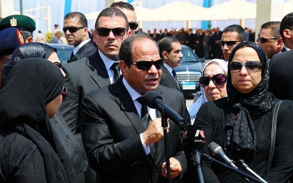 Egyptian President Abdel-Fattah el-Sissi, center, speaks at the funeral of the top public prosecutor Hisham Barakat, killed in a terrorist attack, June 30, 2015. (Egyptian Presidency via AP, File)