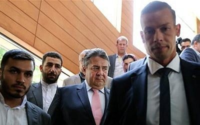 German Vice Chancellor and Economy Minister Sigmar Gabriel, center, makes his way to a conference after a round of talks with Iranian Oil Minister Bijan Zanganeh in Tehran, Iran, July 20, 2015 (AP Photo/Ebrahim Noroozi)
