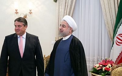 German Vice Chancellor and Economy Minister Sigmar Gabriel, left, stands with Iran's president Hassan Rouhani at his office in Tehran, Iran, July 20, 2015 (AP Photo/Ebrahim Noroozi)