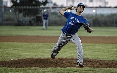 In this Monday, July 20, 2015 photo, Israel baseball team pitcher Dean Kremer pitches during training near the city of Petah Tikva, Israel. (AP/Tsafrir Abayov)