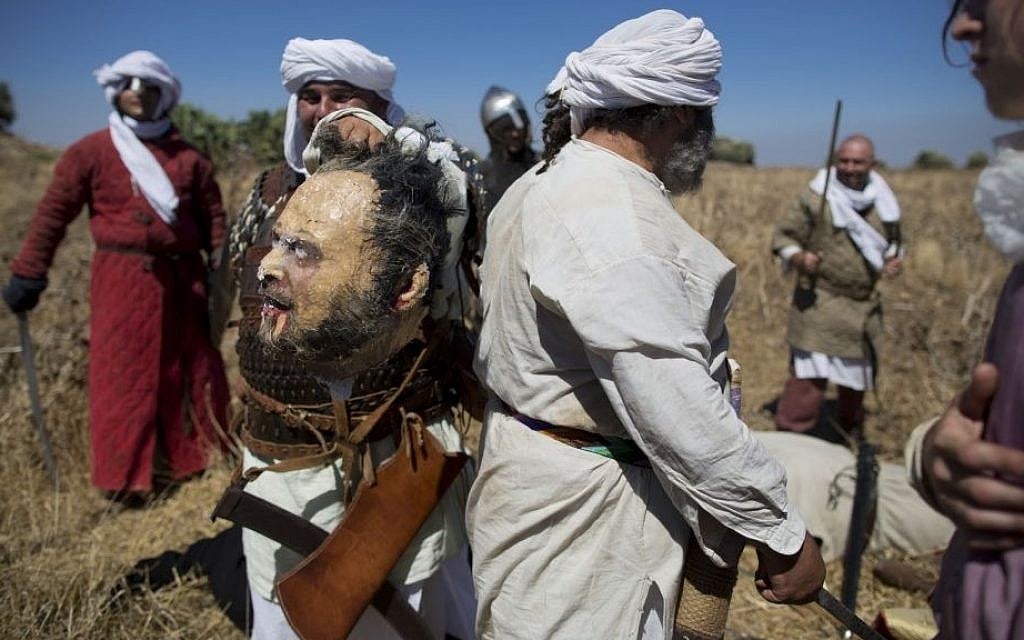 Israeli and Russian members of knight clubs participate in the reenactment of the Battle of Hattin in the Horns of Hattin, northern Israel, July 4, 2015 (AP/Oded Balilty)