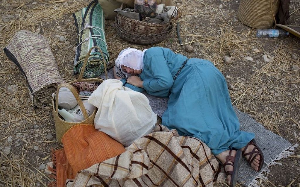 An Israeli member of a knight club rests in camp before marching 27 kilometers (17 miles) to the reenactment of the Battle of Hattin from the ancient northern city of Zippori to the Horns of Hattin, northern Israel, July 2, 2015. (AP/Oded Balilty)