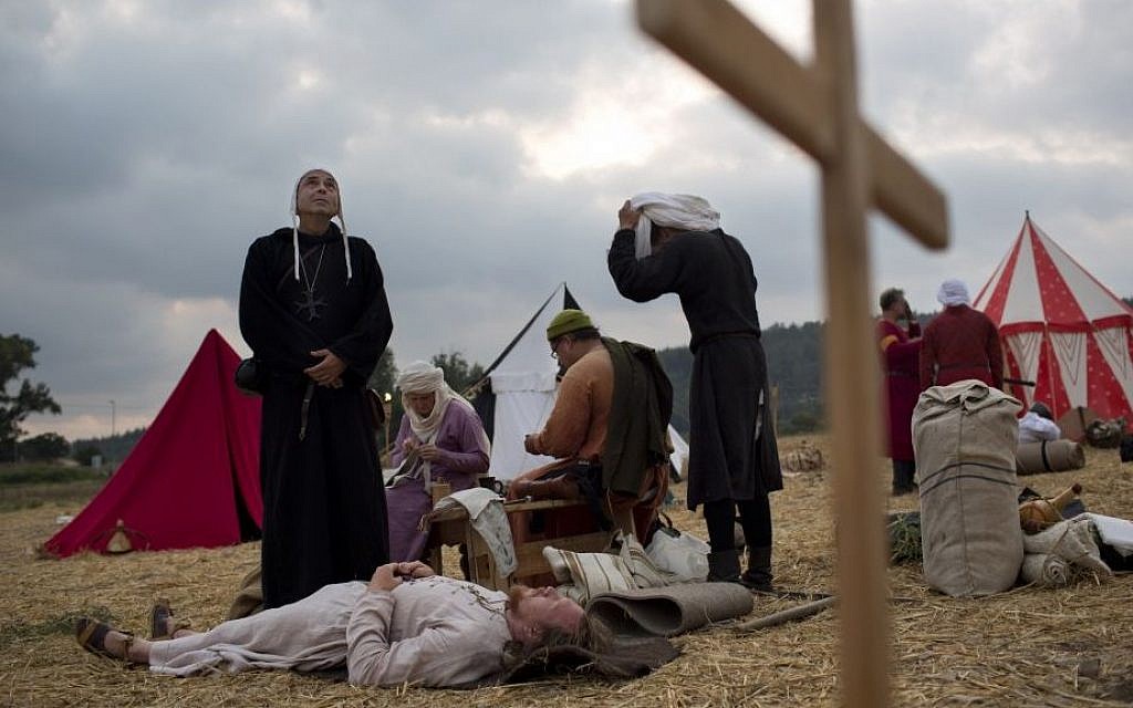 Israeli and Russian members of knight clubs wearing medieval costumes wait in their camp before marching to the reenactment of the Battle of Hattin (AP/Oded Balilty)