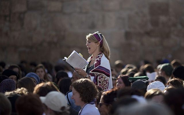 In this Monday, Nov. 4, 2013, file photo, a Jewish woman wears a prayer shawl as she prays at the Western Wall, the holiest site where Jews can pray in Jerusalem's Old City. (AP Photo/Ariel Schalit, File) In this Monday, Nov. 4, 2013, file photo, a Jewish woman wears a prayer shawl as she prays at the Western Wall, the holiest site where Jews can pray in Jerusalem's Old City. (AP Photo/Ariel Schalit, File)