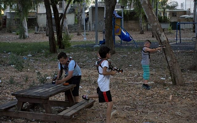 In this Monday, June 22, 2015 photo, Israeli youth play with laser guns in the southern Israeli town of Sderot, next to the Israel-Gaza border. (Oded Balilty/AP) 